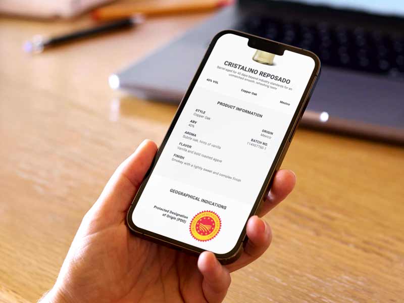Mobile phone displaying detailed product information powered by smart packaging technology | Markem-Imaje